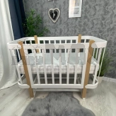 напівкругле ліжечко з маятником